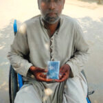 Ashiq sitting down with Navigator in his hand